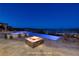 Inviting pool area with spa, fire pit and stunning views at 8 Laricola Ct, Henderson, NV 89011