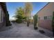 Side yard with desert landscaping and a glimpse of the lake at 8 Laricola Ct, Henderson, NV 89011
