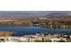 Luxury waterfront property with lake views and mountains in the distance at 8 Laricola Ct, Henderson, NV 89011