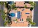 Overhead aerial view of property featuring a pool, landscaping, and solar panels at 8205 Taos Paseo Ave, Las Vegas, NV 89128