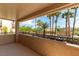 Outdoor balcony featuring wrought iron railings and views of tropical landscaping at 8205 Taos Paseo Ave, Las Vegas, NV 89128