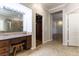 Bathroom vanity with granite counters and views into the custom shower and walk-in closet at 8205 Taos Paseo Ave, Las Vegas, NV 89128