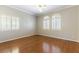 Bedroom with hardwood floors, neutral walls, crown molding and plantation shutters at 8205 Taos Paseo Ave, Las Vegas, NV 89128
