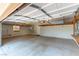 Spacious garage with high ceilings, ample storage, and utility connections at 8205 Taos Paseo Ave, Las Vegas, NV 89128