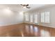 Open living area with hardwood floors, plantation shutters, and french doors at 8205 Taos Paseo Ave, Las Vegas, NV 89128