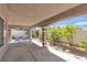 A covered back porch features brick columns and a view of the private backyard at 8437 Apple Hill Ct, Las Vegas, NV 89128