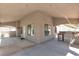 A covered outdoor kitchen features stainless steel appliances and a concrete floor at 8437 Apple Hill Ct, Las Vegas, NV 89128