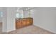 Elegant bar area with granite counters and dark wooden cabinets at 8437 Apple Hill Ct, Las Vegas, NV 89128