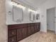 Modern bathroom with dual vanities, bright mirrors, and beautiful marble flooring at 8437 Apple Hill Ct, Las Vegas, NV 89128