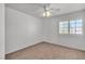 Comfortable bedroom with a bright window and neutral color palette at 8437 Apple Hill Ct, Las Vegas, NV 89128