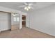 Spacious bedroom featuring access to a kitchen and mirrored closet at 8437 Apple Hill Ct, Las Vegas, NV 89128