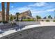 Traditional home featuring mature landscaping, stucco privacy wall and desert plantings at 8437 Apple Hill Ct, Las Vegas, NV 89128