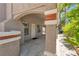 Covered front porch with columns with tile accents and well-maintained landscaping at 8437 Apple Hill Ct, Las Vegas, NV 89128