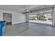 Garage with ample space and an open view to the driveway and landscaping at 8437 Apple Hill Ct, Las Vegas, NV 89128