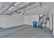 Large garage with built-in cabinets and epoxy floors providing ample storage space at 8437 Apple Hill Ct, Las Vegas, NV 89128