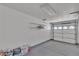 Clean garage interior with shelving and an insulated garage door for energy efficiency at 8437 Apple Hill Ct, Las Vegas, NV 89128