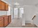 Well-lit hallway with hardwood cabinets, doorways, and staircase at 8437 Apple Hill Ct, Las Vegas, NV 89128