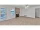Open-concept living room featuring tiled floors and a modern fireplace at 8437 Apple Hill Ct, Las Vegas, NV 89128