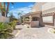 Charming covered patio with brick flooring and a convenient outdoor bar area perfect for entertaining at 8437 Apple Hill Ct, Las Vegas, NV 89128