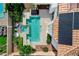 Aerial view of a sparkling pool and spa surrounded by a lush landscape and modern design elements at 8713 Castle Ridge Ave, Las Vegas, NV 89129