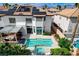 Beautiful backyard with a sparkling pool, patio, and a well-maintained garden area at 8713 Castle Ridge Ave, Las Vegas, NV 89129