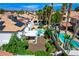 A private backyard with a pool, lush landscaping, and desert climate-friendly design at 8713 Castle Ridge Ave, Las Vegas, NV 89129