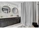 Bathroom featuring a double vanity and modern fixtures and lighting at 8713 Castle Ridge Ave, Las Vegas, NV 89129