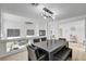 Bright dining room features modern lighting and spacious seating at 8713 Castle Ridge Ave, Las Vegas, NV 89129