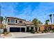 Charming two-story home with a three car garage and landscaped front yard at 8713 Castle Ridge Ave, Las Vegas, NV 89129
