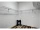 Functional laundry room with overhead wire rack shelving, perfect for keeping organized at 8713 Castle Ridge Ave, Las Vegas, NV 89129
