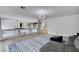 Open concept living room featuring modern decor and stylish accent rug at 8713 Castle Ridge Ave, Las Vegas, NV 89129