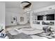 Spacious living area featuring a modern fireplace, staircase, and open floor plan at 8713 Castle Ridge Ave, Las Vegas, NV 89129