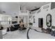 Spacious living room with staircase and open access to kitchen at 8713 Castle Ridge Ave, Las Vegas, NV 89129