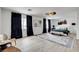 Spacious main bedroom with large windows and a contemporary design at 8713 Castle Ridge Ave, Las Vegas, NV 89129