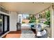 Inviting covered patio featuring comfortable seating, a grill, and access to the sparkling pool at 8713 Castle Ridge Ave, Las Vegas, NV 89129