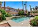 Backyard swimming pool with pristine water, landscaping, and cozy lounge area at 8713 Castle Ridge Ave, Las Vegas, NV 89129