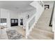 Beautiful staircase features a glass railing and modern design at 8713 Castle Ridge Ave, Las Vegas, NV 89129