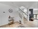 Bright staircase with white railings and light wood steps at 8713 Castle Ridge Ave, Las Vegas, NV 89129