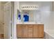 Bright bathroom with double sink vanity and bathtub, adjoining the closet area at 9303 Gilcrease Ave # 1056, Las Vegas, NV 89149