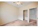 Bedroom featuring neutral carpet and a closet with shelving for organized storage at 9303 Gilcrease Ave # 1056, Las Vegas, NV 89149