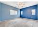 Large primary bedroom with two windows providing natural light at 9303 Gilcrease Ave # 1056, Las Vegas, NV 89149