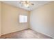 Standard bedroom featuring neutral carpet, a ceiling fan, and a single window at 9303 Gilcrease Ave # 1056, Las Vegas, NV 89149