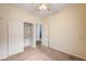 Carpeted bedroom features a closet and an open doorway to the rest of the house at 9303 Gilcrease Ave # 1056, Las Vegas, NV 89149