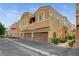 Inviting two-story townhome featuring a two-car garage and well-maintained landscaping at 9303 Gilcrease Ave # 1056, Las Vegas, NV 89149