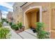 Inviting front entrance featuring a covered porch and landscaped surroundings at 1056 at 9303 Gilcrease Ave # 1056, Las Vegas, NV 89149