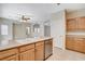 Kitchen area with peninsula, stainless steel dishwasher, sink and light colored cabinetry at 9303 Gilcrease Ave # 1056, Las Vegas, NV 89149