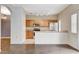 Open kitchen with stainless steel appliances, breakfast bar and bright lighting at 9303 Gilcrease Ave # 1056, Las Vegas, NV 89149