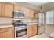 Kitchen features stainless steel appliances, light cabinetry and ample counter space at 9303 Gilcrease Ave # 1056, Las Vegas, NV 89149