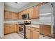 Kitchen features stainless steel appliances, light cabinetry and ample counter space at 9303 Gilcrease Ave # 1056, Las Vegas, NV 89149