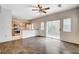Open floor plan combines living room and kitchen with stainless steel appliances and breakfast bar at 9303 Gilcrease Ave # 1056, Las Vegas, NV 89149